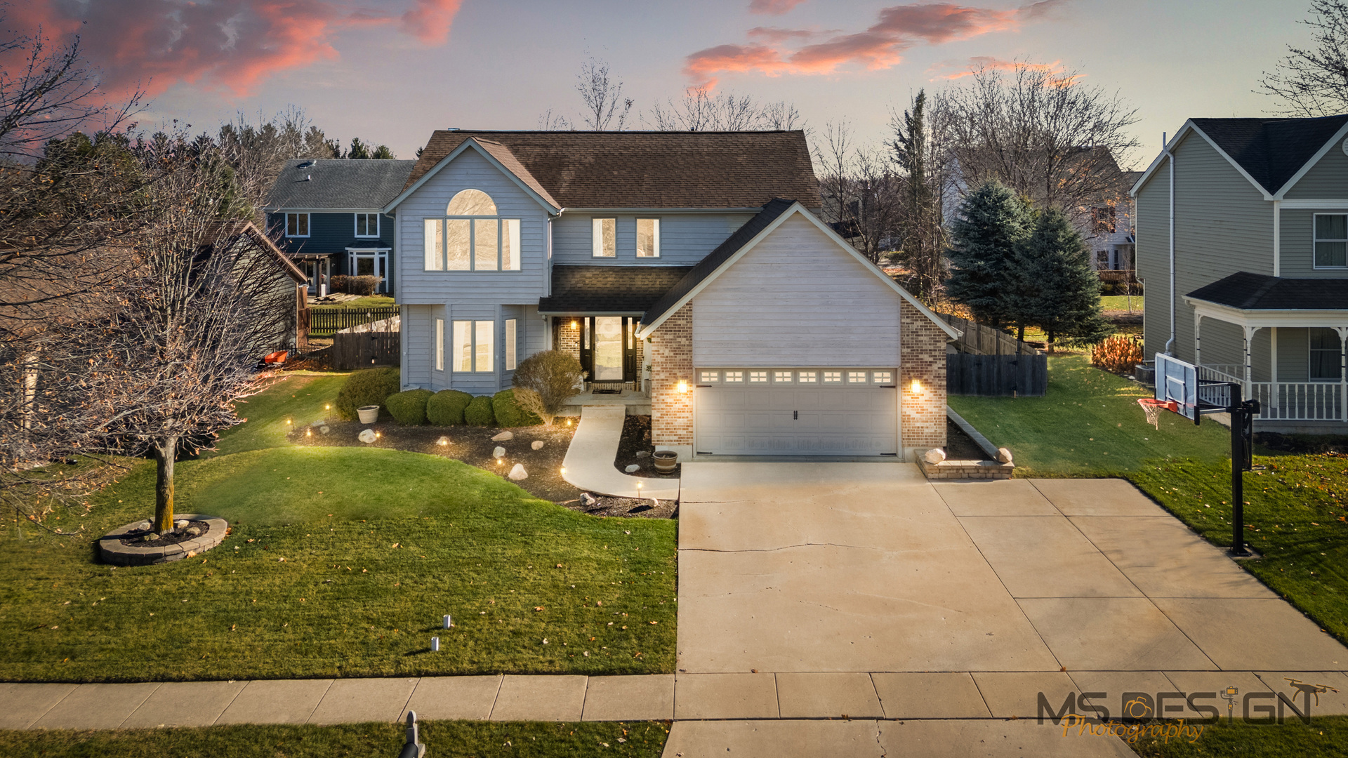 932 Foxpointe Drive Sycamore, IL 60178 - Photo 1 of 52 a front view of a house with a yard