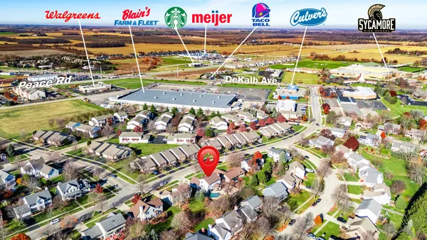 an aerial view of houses with yard