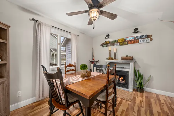 a living room with furniture fireplace and flat screen tv