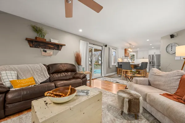 a view of a dining room with furniture window and wooden floor