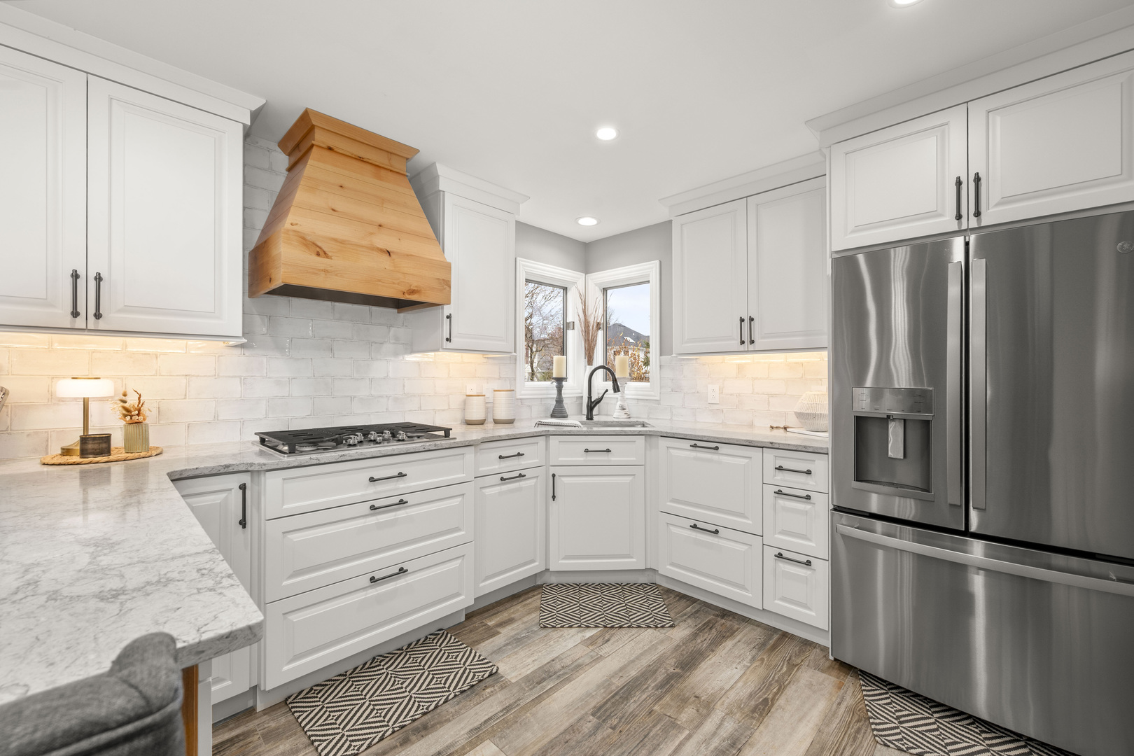 932 Foxpointe Drive Sycamore, IL 60178 - Photo 25 of 52 a kitchen with granite countertop white cabinets and stainless steel appliances