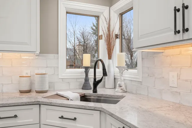 a bathroom with a toilet a sink and a mirror