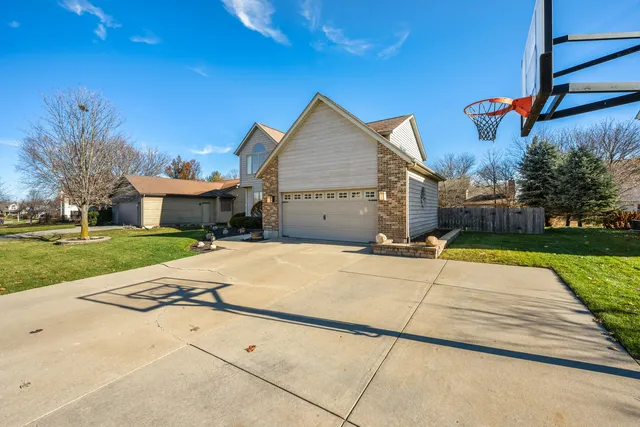 a front view of a house with yard