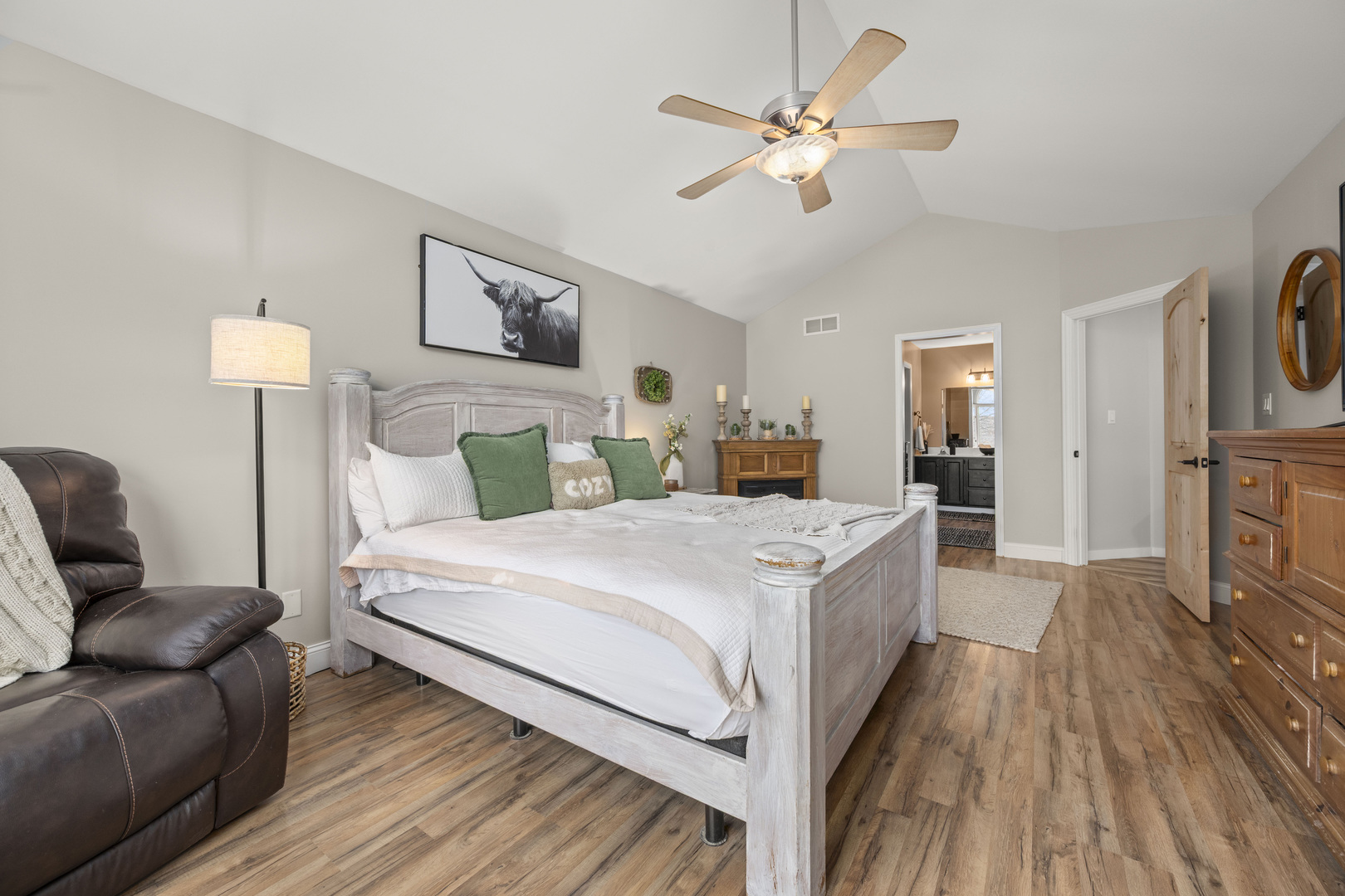 932 Foxpointe Drive Sycamore, IL 60178 - Photo 32 of 52 a spacious bedroom with a bed and a chandelier