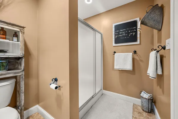 a bedroom with bed and large window