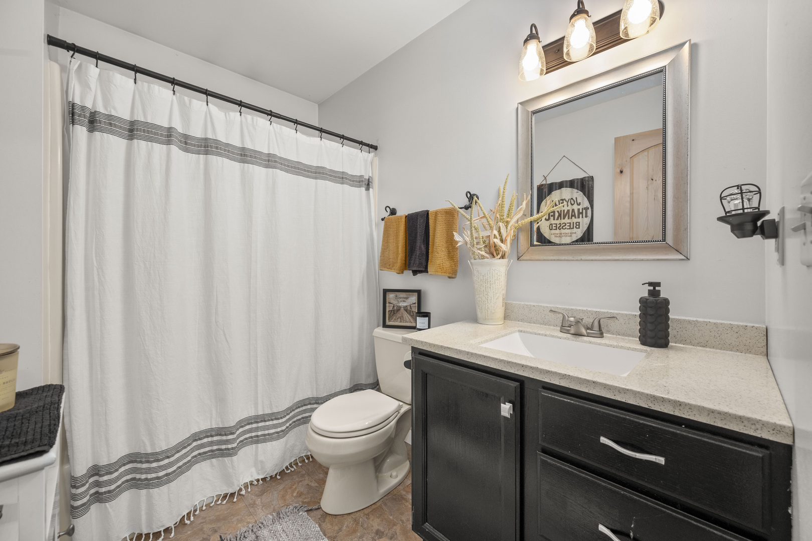 932 Foxpointe Drive Sycamore, IL 60178 - Photo 39 of 52 a bathroom with a sink a toilet and a mirror