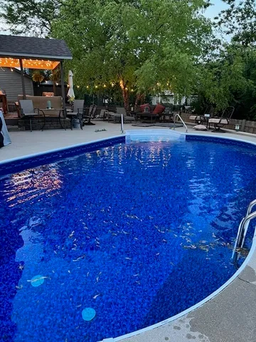 a view of a swimming pool with a patio