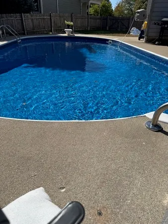 a view of a patio with swimming pool table and chairs