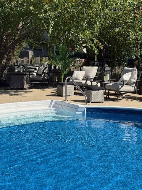 932 Foxpointe Drive Sycamore, IL 60178 - Photo 48 of 52 a view of a patio with swimming pool table and chairs