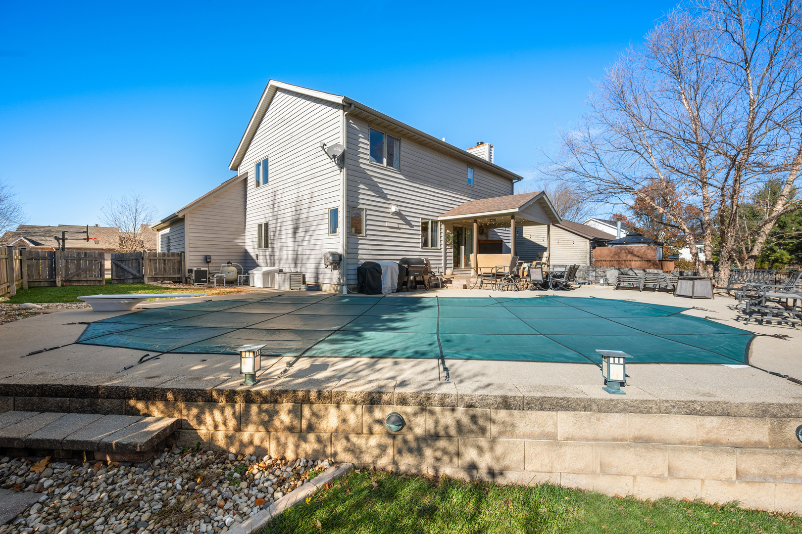 932 Foxpointe Drive Sycamore, IL 60178 - Photo 6 of 52 a view of a white house next to a yard with big trees