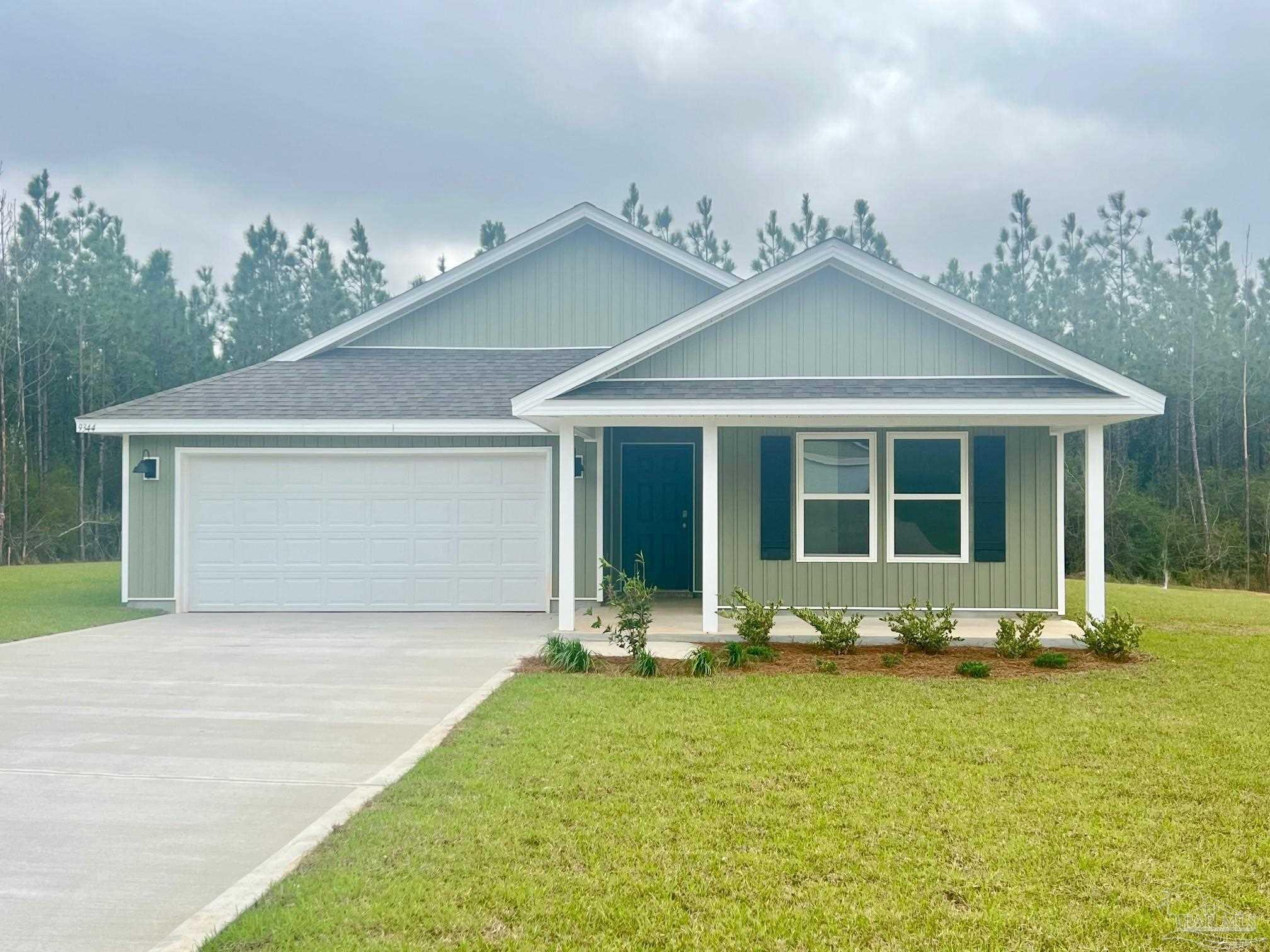 9344 3 Hollow Road Jay, FL 32565 - Photo 2 of 14 front view of a house with a yard