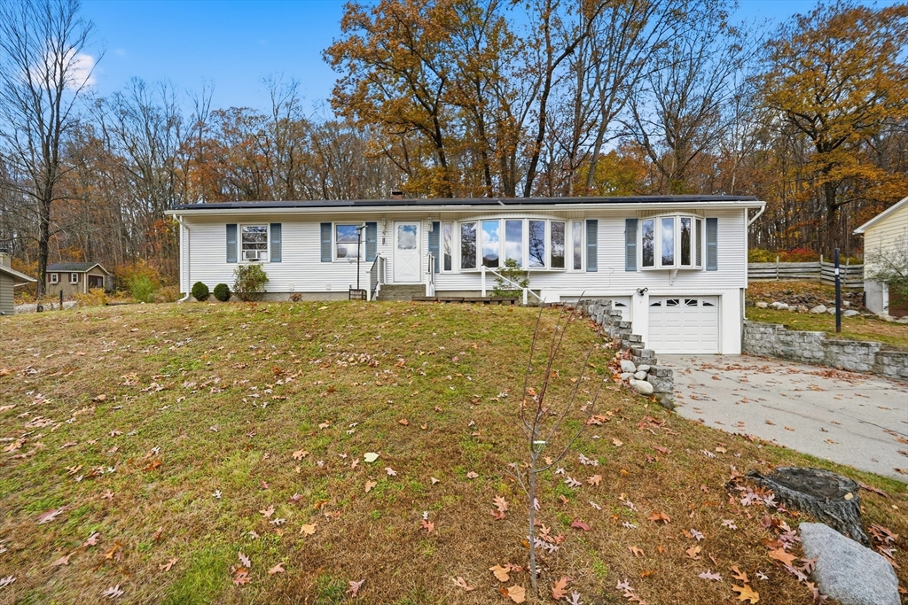 a front view of house with yard