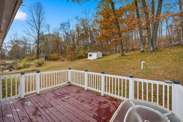 a view of balcony with wooden floor