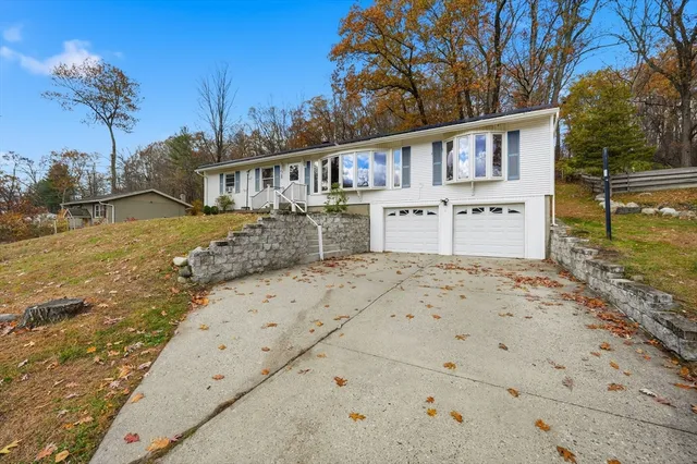 front view of a house with a yard
