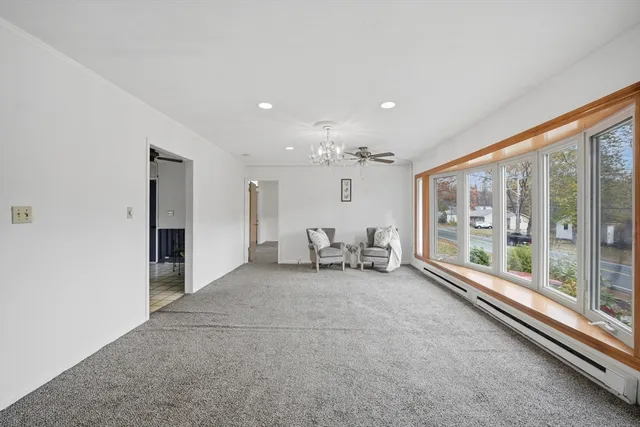 a view of an empty room with a fireplace
