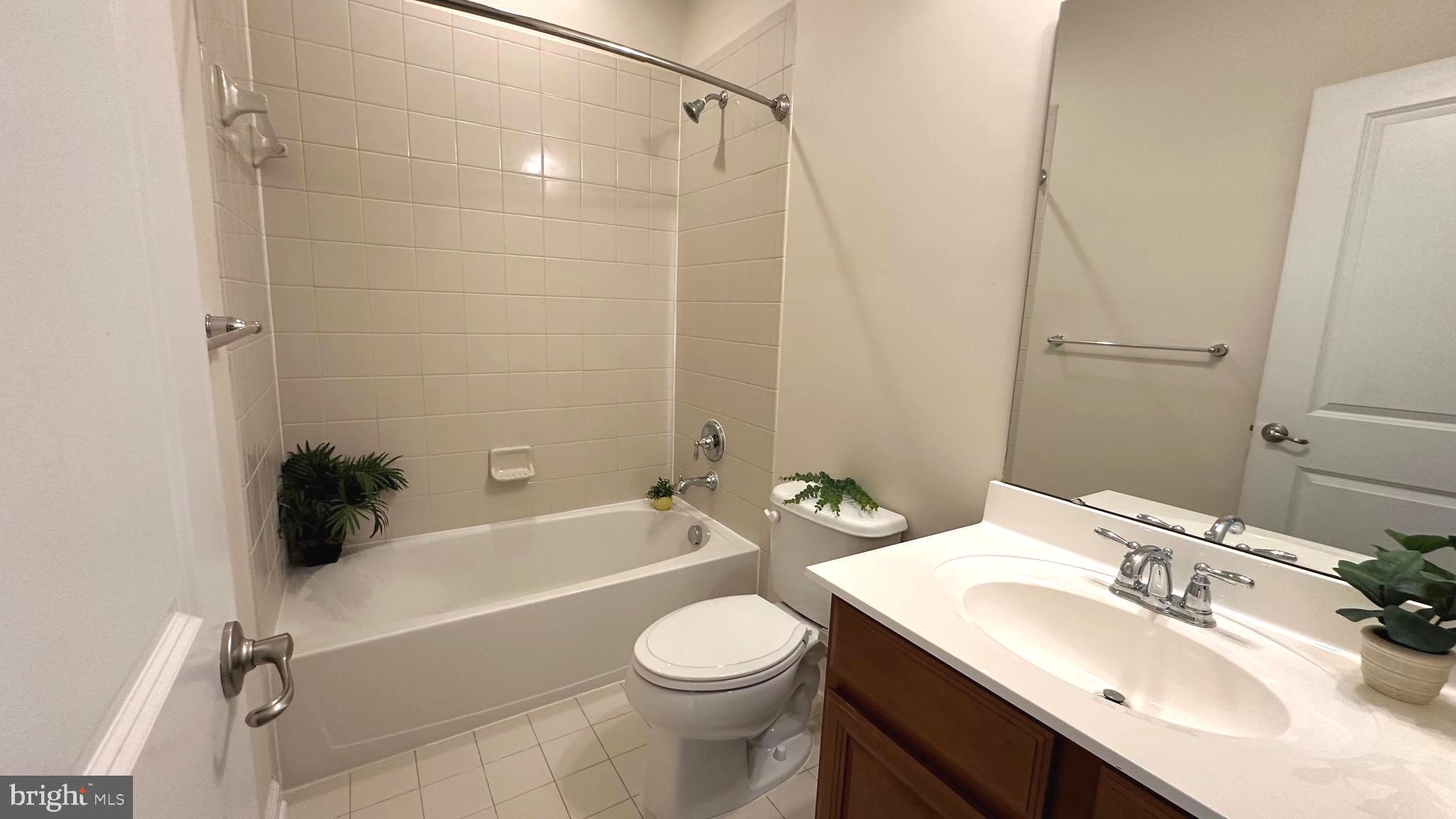 7343 Old Calvary Road Hanover, MD 21076 - Photo 29 of 35 a bathroom with a sink toilet vanity and shower
