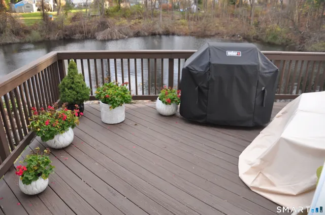 a view of a chairs and table in the balcony