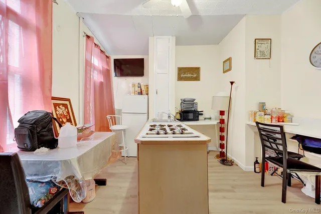 a dining room with furniture and a window
