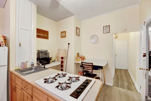 a kitchen with a table chairs and a stove