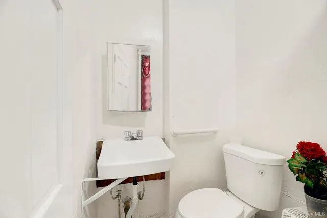 a bathroom with a toilet and a sink