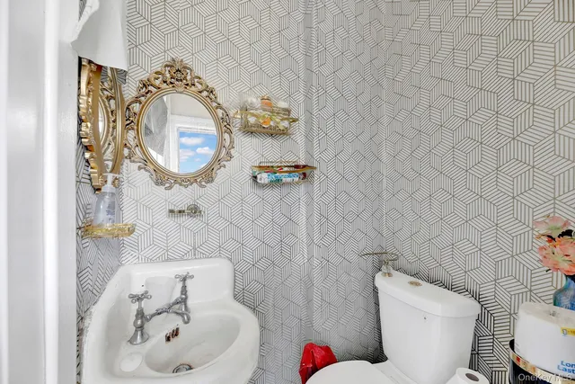 a bedroom with furniture and a baby crib