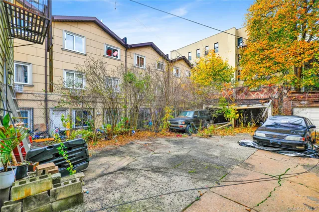 a front view of a building with blue umbrellas