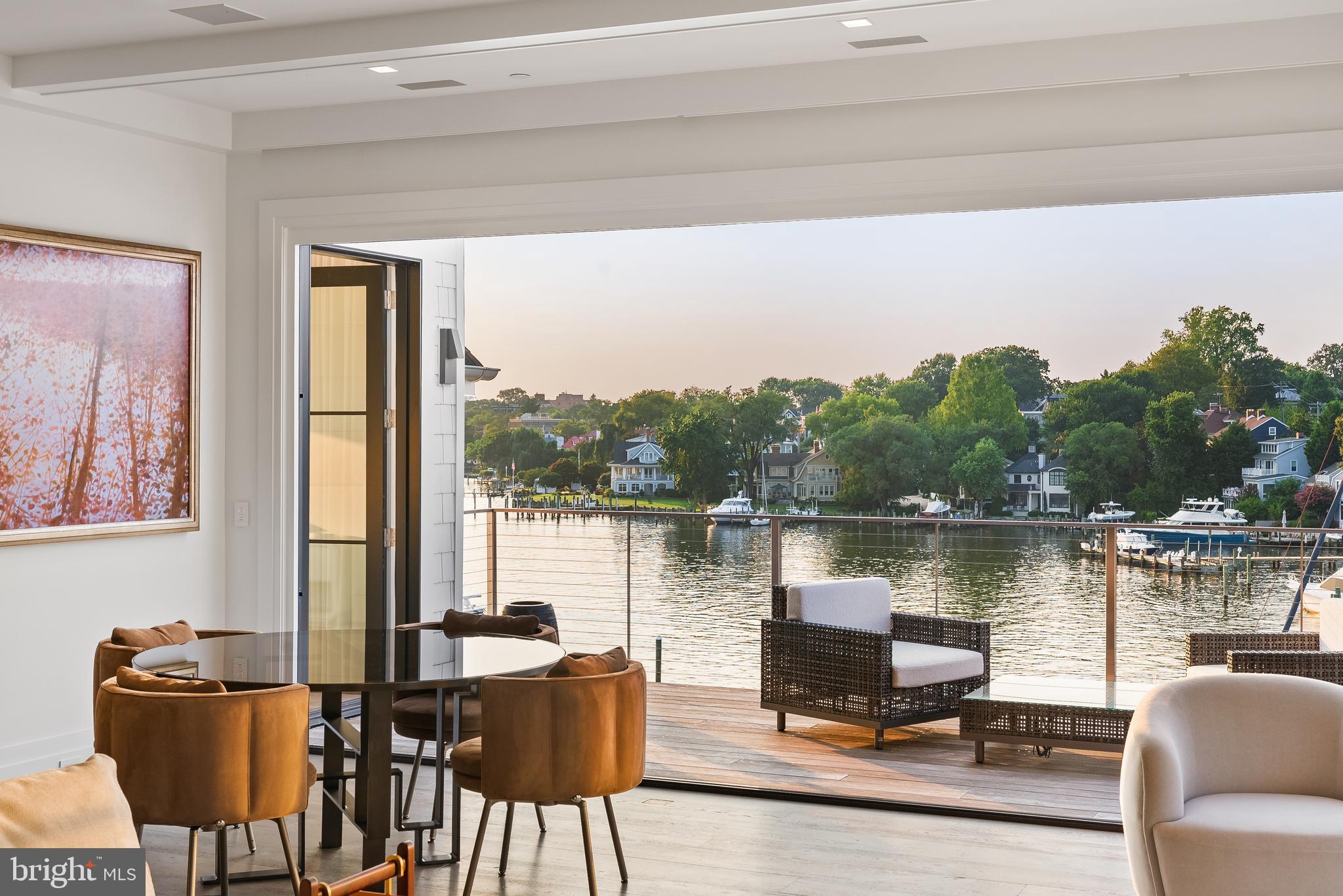 287 State Street, Unit 3 Annapolis, MD 21403 - Photo 10 of 43 a view of a lake with couches chairs and a table