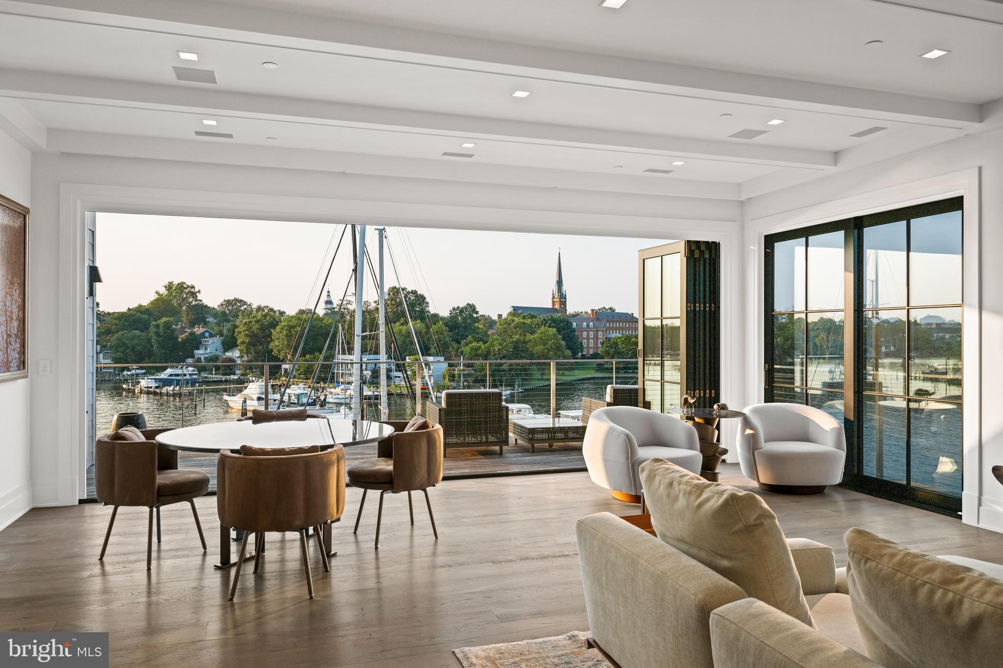 287 State Street, Unit 3 Annapolis, MD 21403 - Photo 11 of 43 a living room with patio furniture and a floor to ceiling window