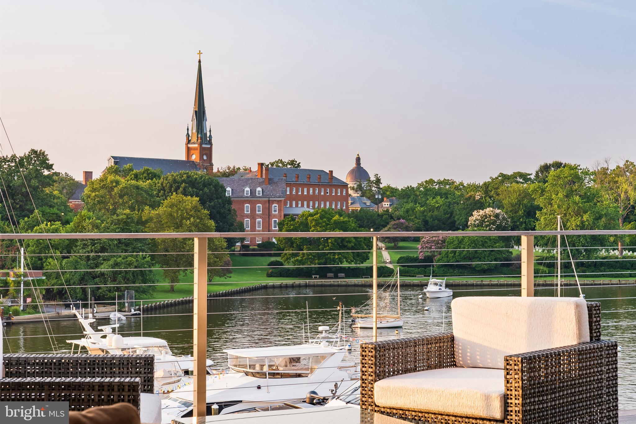 287 State Street, Unit 3 Annapolis, MD 21403 - Photo 13 of 43 a view of a lake from a balcony with two chairs