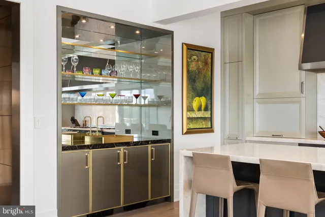 a kitchen with a dining table and chairs