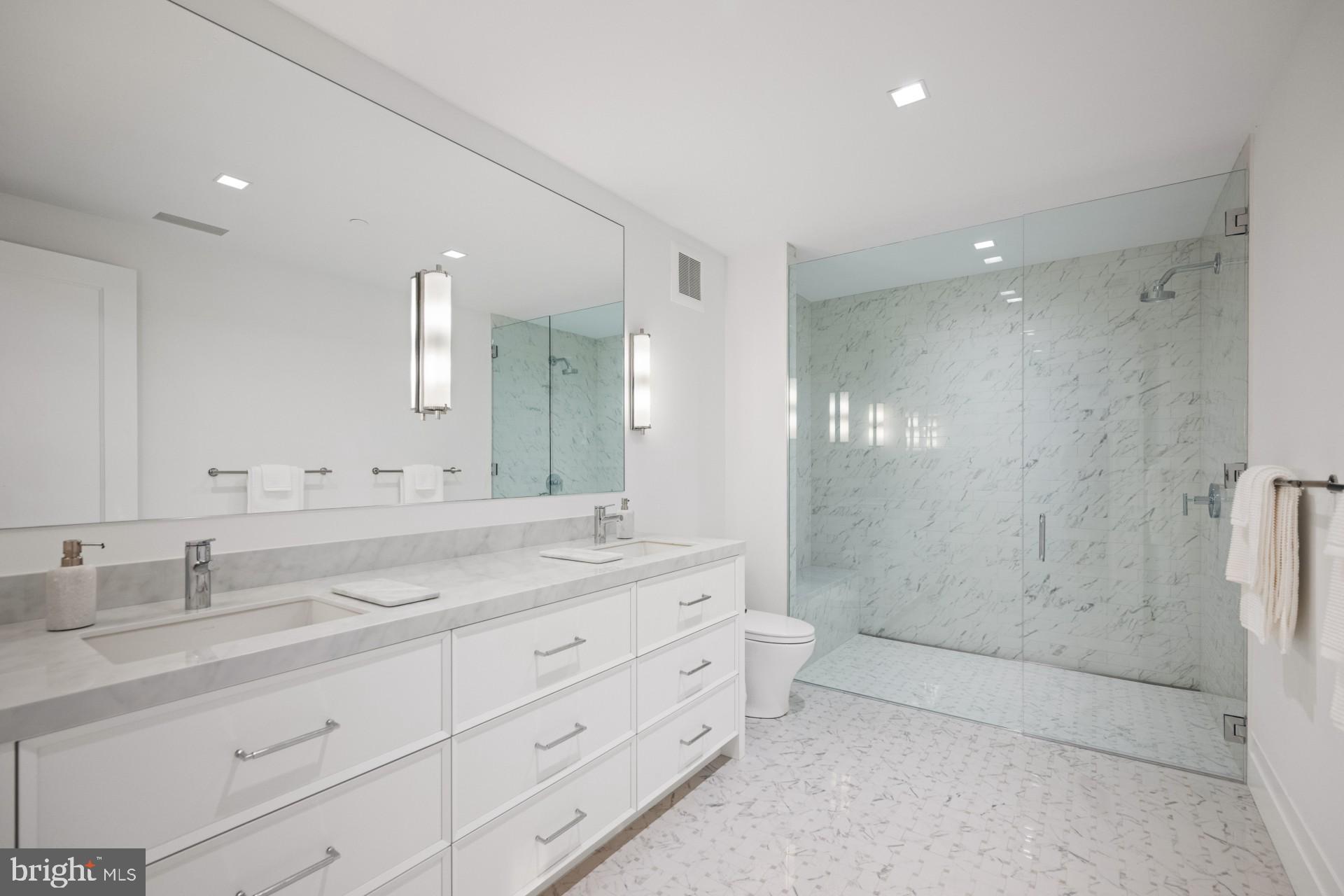 287 State Street, Unit 3 Annapolis, MD 21403 - Photo 33 of 43 a bathroom with a double vanity sink mirror double and shower