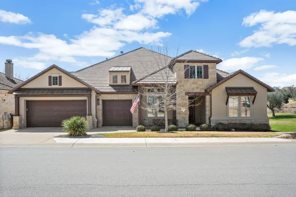 a front view of a house with yard