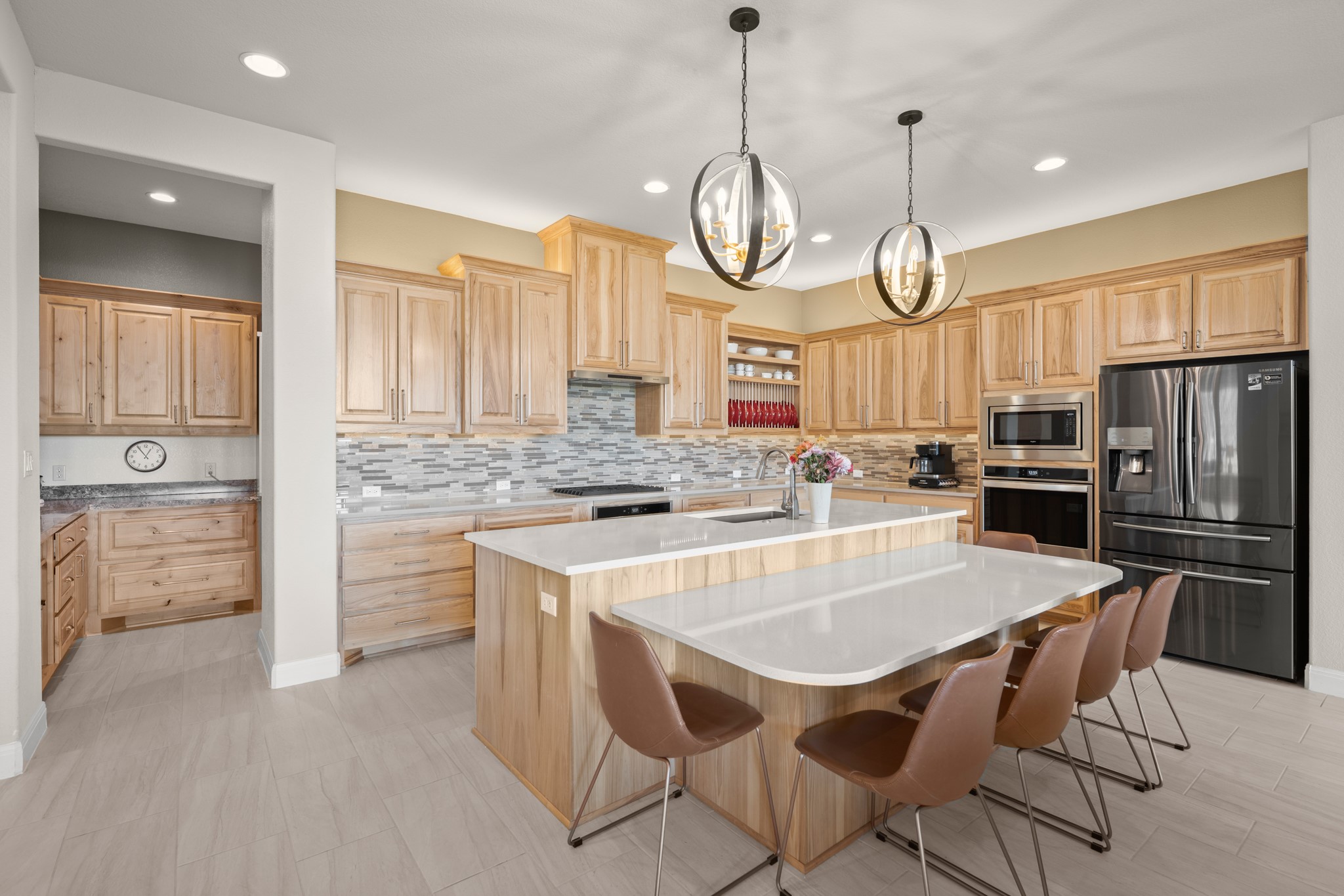 14913 Spillman Ranch Loop Austin, TX 78738 - Photo 14 of 40 Premier stainless-steel appliances elevate the cooking experience.