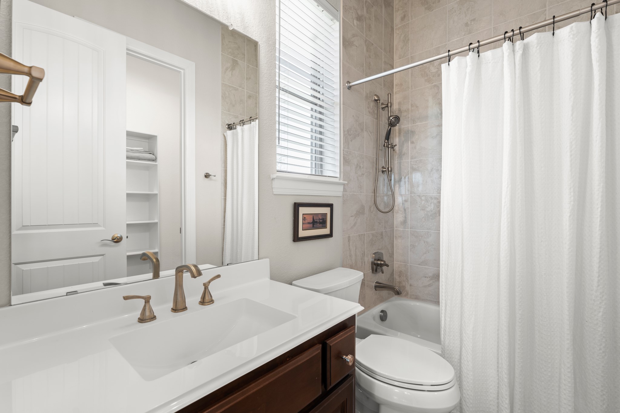 14913 Spillman Ranch Loop Austin, TX 78738 - Photo 28 of 40 Spacious vanities provide generous counter space for daily routines.