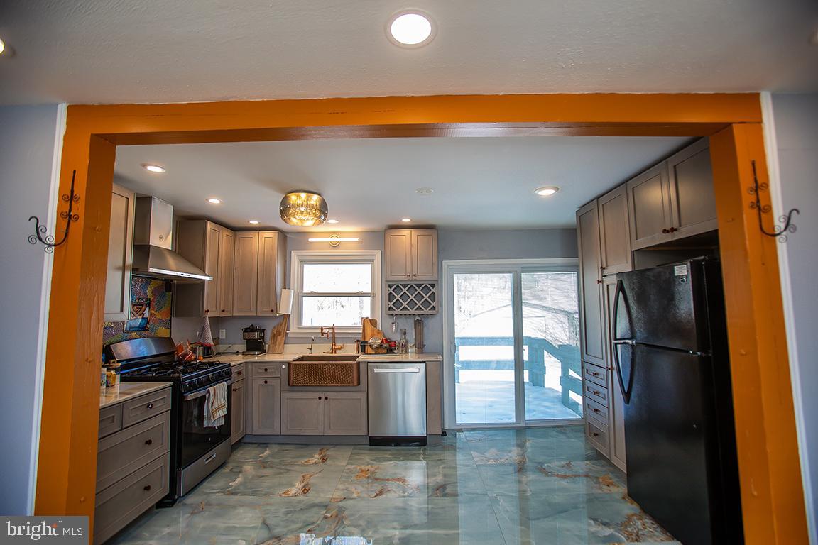 2818 Rome Road Vineland, NJ 08361 - Photo 15 of 31 a kitchen with stainless steel appliances a refrigerator and a stove