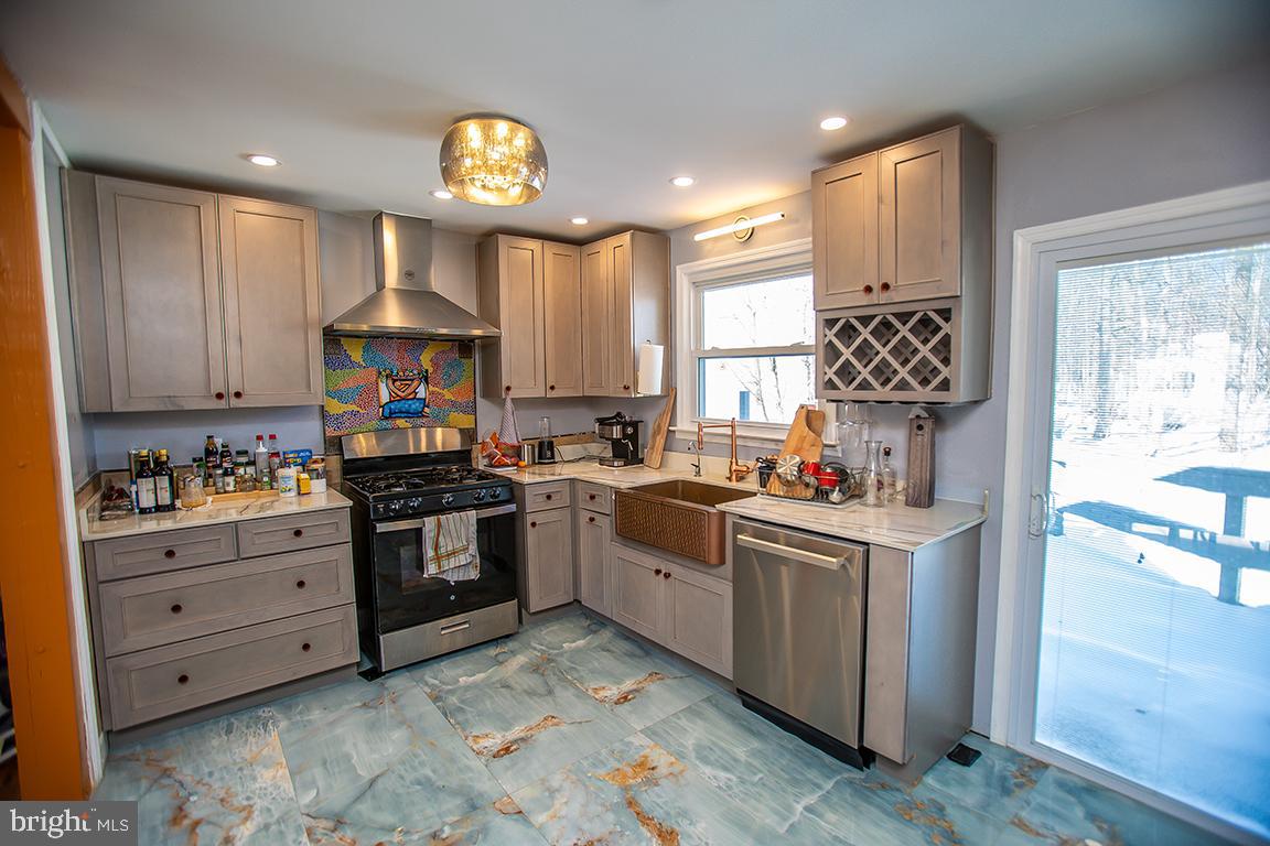 2818 Rome Road Vineland, NJ 08361 - Photo 16 of 31 a kitchen with granite countertop a sink stainless steel appliances and cabinets