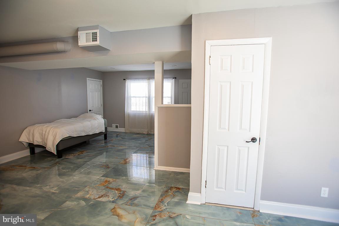 2818 Rome Road Vineland, NJ 08361 - Photo 2 of 31 a spacious bedroom with a bed and a window