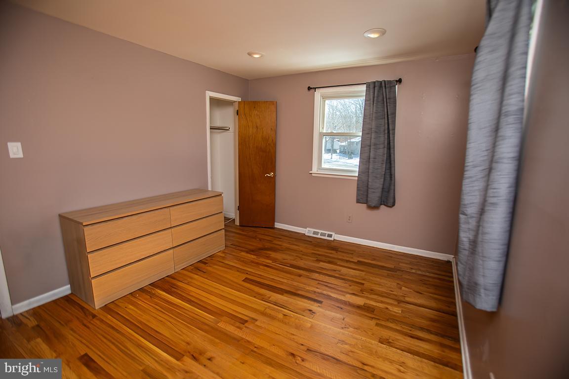 2818 Rome Road Vineland, NJ 08361 - Photo 29 of 31 a view of room with window and wooden floor