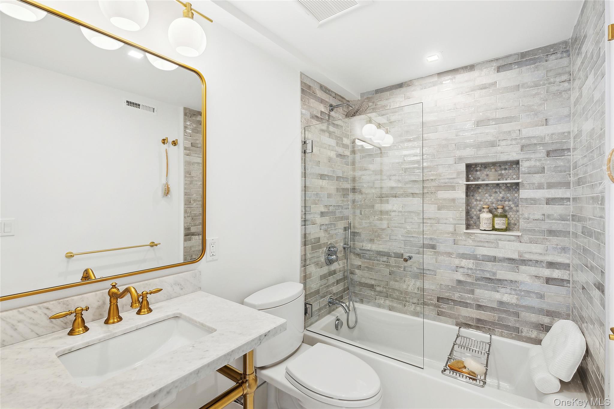 2803 Noyack Road Sag Harbor, NY 11963 - Photo 12 of 15 a bathroom with a sink toilet and shower