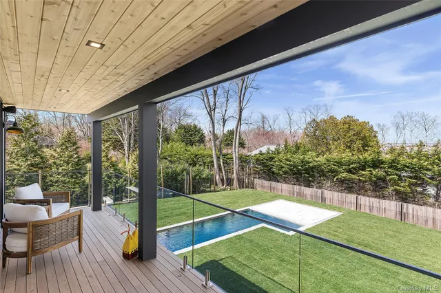 a view of a chairs and table in the patio