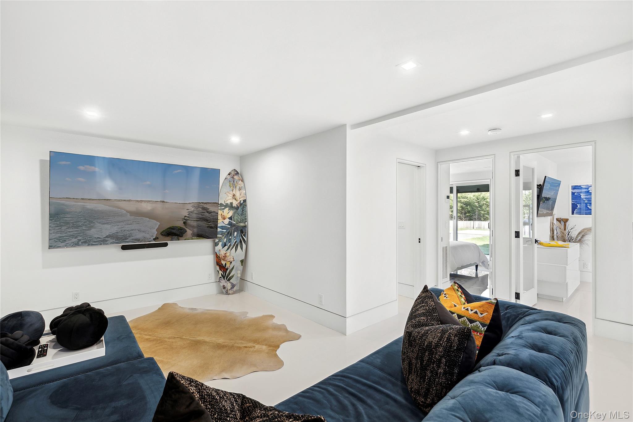 2803 Noyack Road Sag Harbor, NY 11963 - Photo 9 of 15 a living room with furniture and a flat screen tv