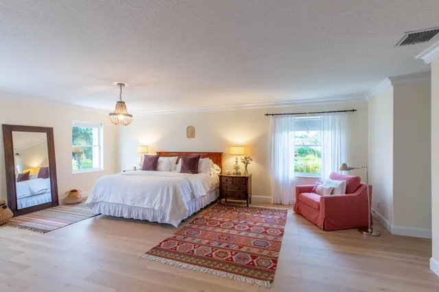 a bedroom with a bed and a couch