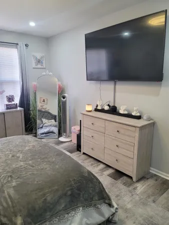 a spacious bathroom with a double vanity sink and a mirror