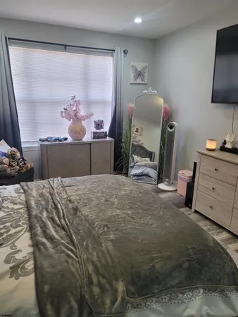 a bedroom with a bed and a television in it