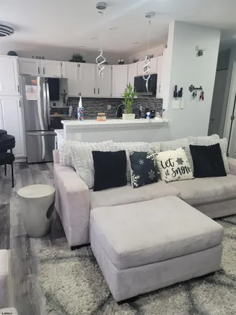 a large bedroom with a bed and couch