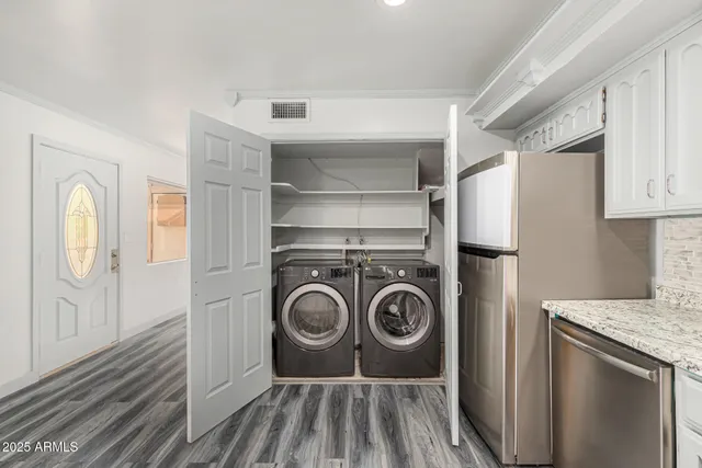 a utility room with dryer and washer