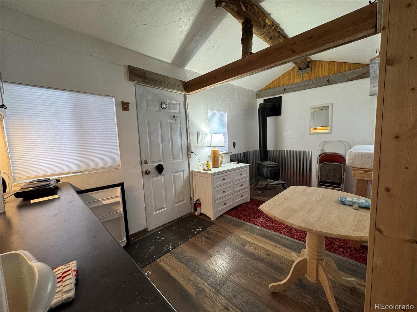 1666 Singletree Road Hartsel, CO 80449 - Photo 3 of 37 a bedroom with furniture and a window