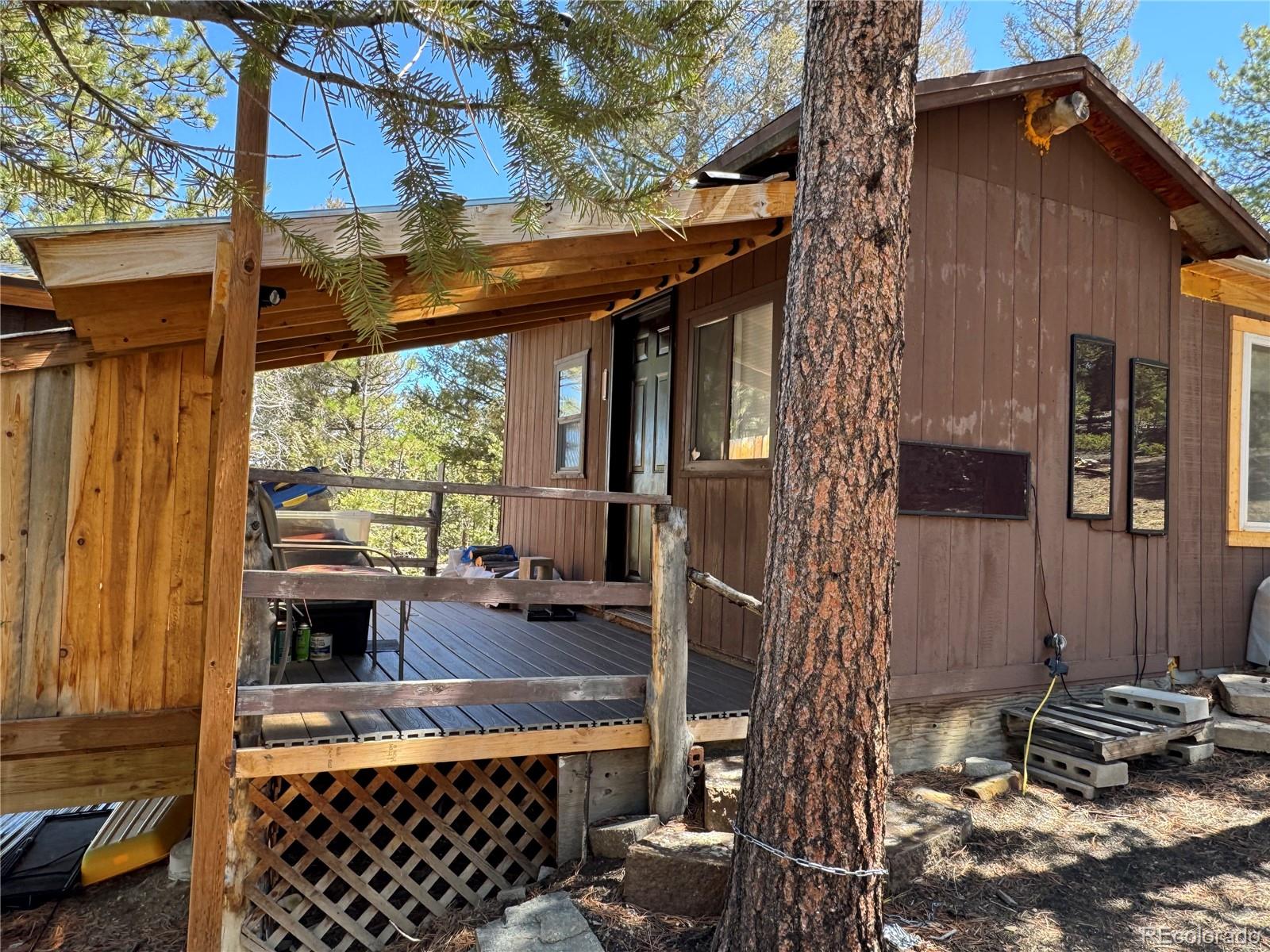 1666 Singletree Road Hartsel, CO 80449 - Photo 34 of 37 a backyard of a house with outdoor seating
