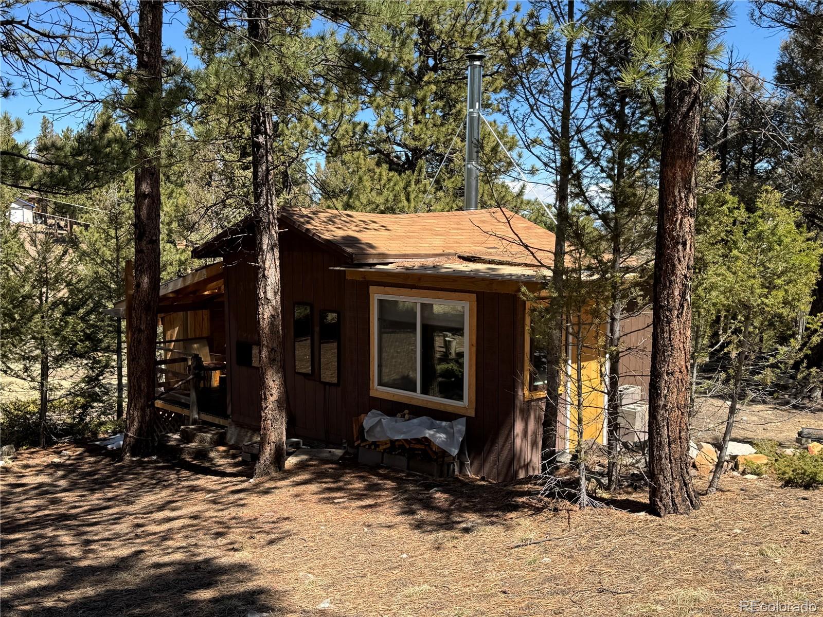 1666 Singletree Road Hartsel, CO 80449 - Photo 37 of 37 a view of a house with a yard