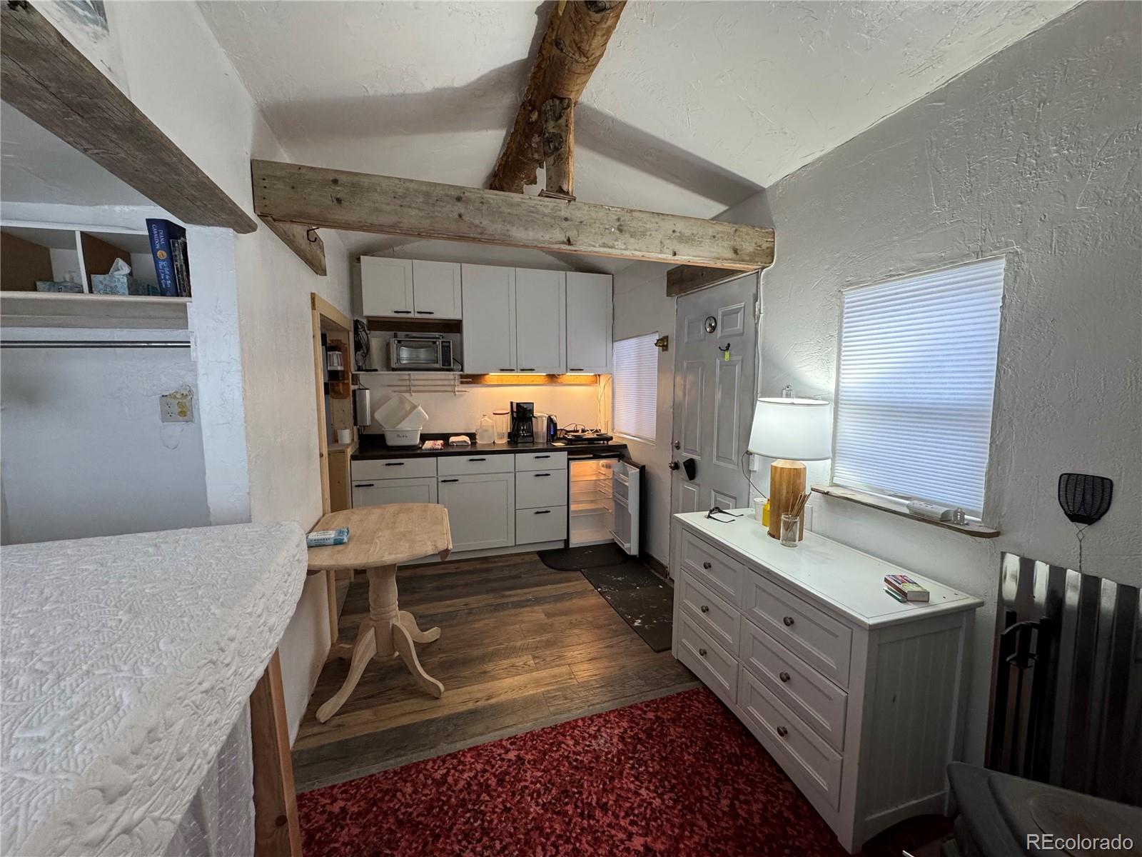 1666 Singletree Road Hartsel, CO 80449 - Photo 5 of 37 a kitchen with stainless steel appliances granite countertop a sink stove and refrigerator